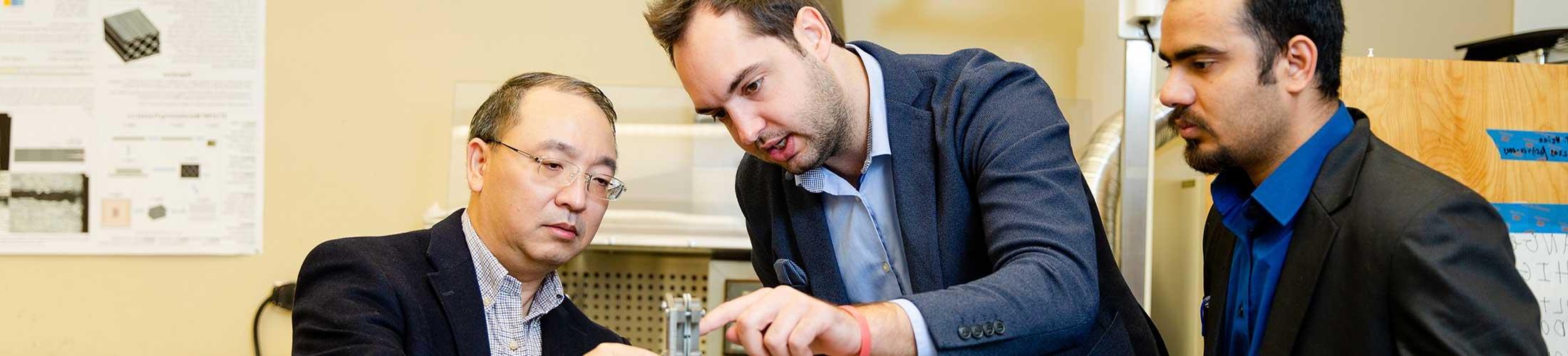 Engineering professors working in lab