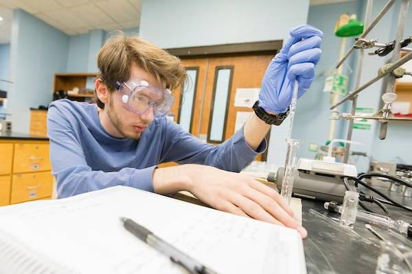 Male student working in lab.